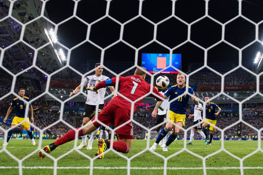 Goalkeeper Manuel Neuer of Germany stops a chance from John