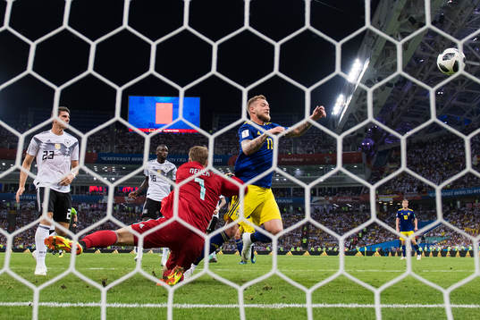 Goalkeeper Manuel Neuer of Germany stops a chance from John