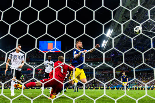 John Guidetti of Sweden against goalkeeper Manuel Neuer of