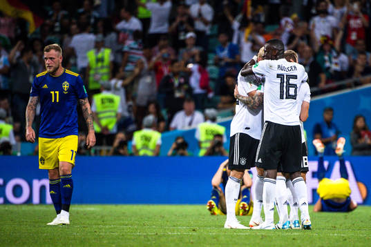 John Guidetti of Sweden looks dejected while Antonio