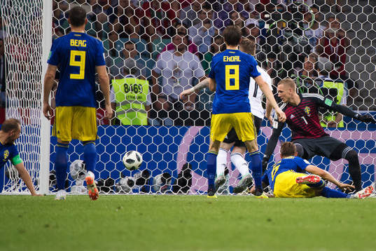 Marco Reus of Germany scores 1-1 behind goalkeeper Robin