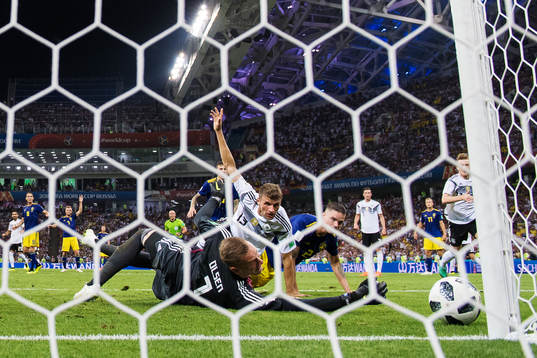 Goalkeeper Robin Olsen of Sweden makes a save from Thomas