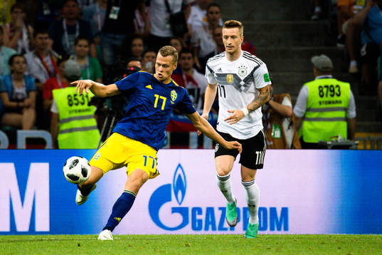 Viktor Claesson of Sweden and Marco Reus of Germany