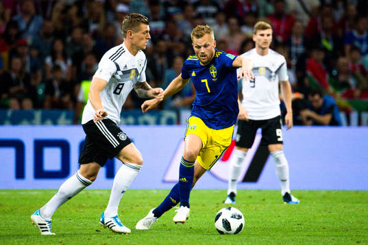 Sebastian Larsson of Sweden and Toni Kroos of Germany