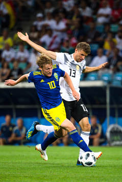 Emil Forsberg of Sweden and Thomas Müller of Germany