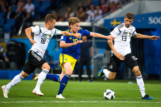 Emil Forsberg of Sweden against Joshua Kimmich and Thomas