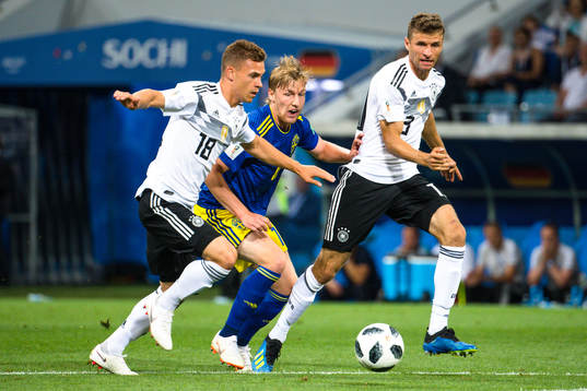 Emil Forsberg of Sweden against Joshua Kimmich and Thomas