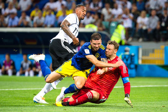 Marcus Berg of Sweden against goalkeeper Manuel Neuer of