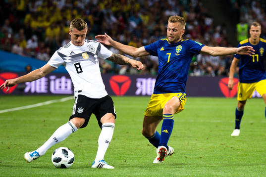 Toni Kroos of Germany and Sebastian Larsson of Sweden
