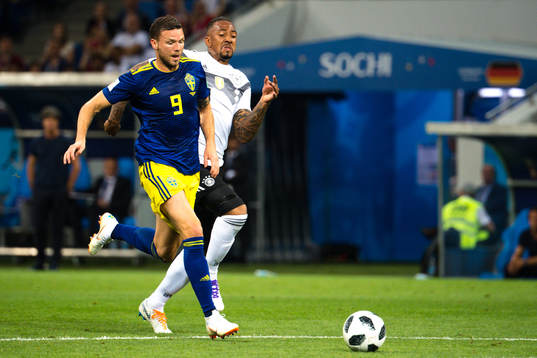 Marcus Berg of Sweden and Jerome Boateng of Germany