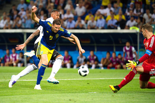 Marcus Berg of Sweden and Jerome Boateng of Germany