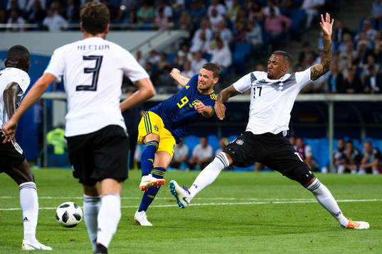 Marcus Berg of Sweden and Jerome Boateng of Germany