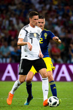Julian Draxler  of Germany and Mikael Lustig of Sweden
