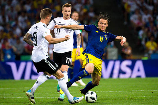 Toni Kroos of Germany and Albin Ekdal of Sweden