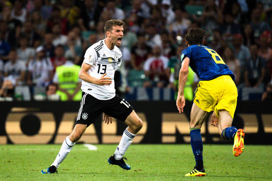 Thomas Müller of Germany and Albin Ekdal of Sweden