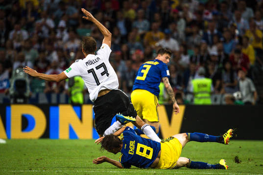 Thomas Müller of Germany and Albin Ekdal of Sweden