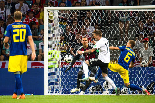 Marco Reus of Germany scores the 1-1 goal behind goalkeeper