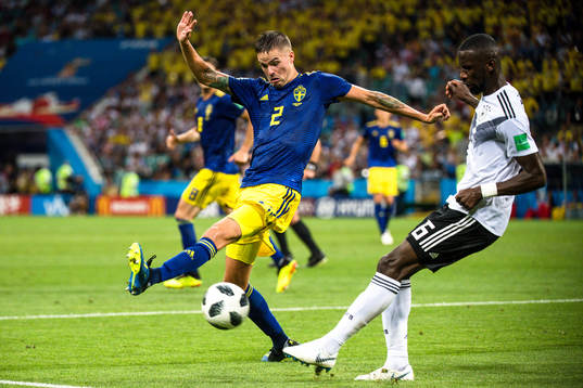 Mikael Lustig of Sweden and Antonio Rüdiger of Germany