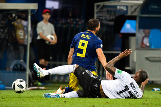 Marcus Berg of Sweden and Jerome Boateng of Germany