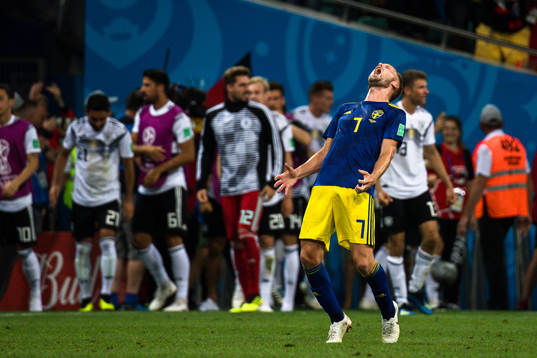 Sebastian Larsson of Sweden looks dejected