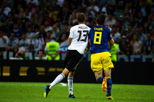Thomas Müller  of Germany and Albin Ekdal of Sweden