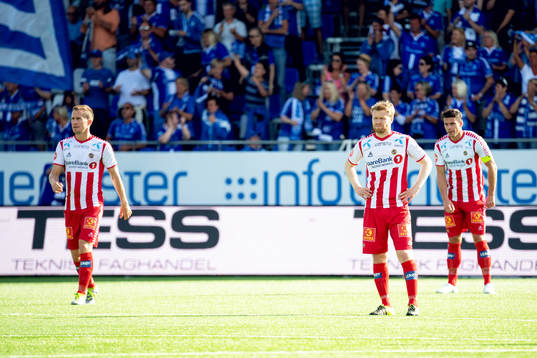 Morten Gamst Pedersen and Tom Høgli of Tromsø looks