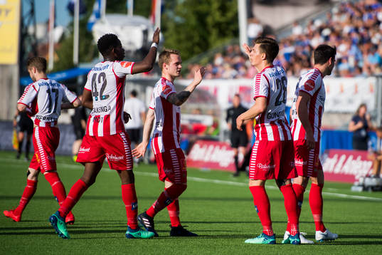 Jostein Gundersen of Tromsø celebrates with his teammates