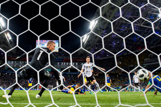 Marco Reus of Germany scores 1-1 behind goalkeeper Robin