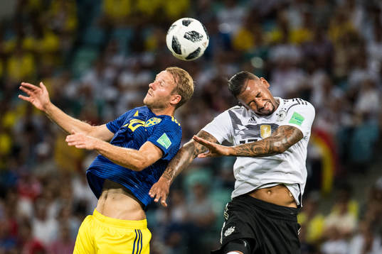 Ola Toivonen of Sweden and Jerome Boateng of Germany