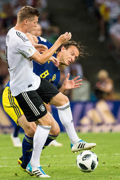 Albin Ekdal of Sweden in action with Toni Kroos of Germany