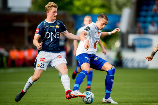 Marius Høibråten of Strømsgodset and Michael Karlsen of