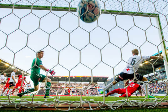 Bismar Acosta of Brann (partly hidden) scores 1-0 behind