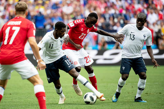 Ousmane Dembele and Ngolo Kante of France and Pione Sisto
