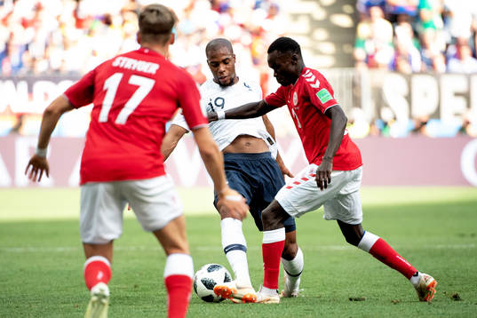 Djibril Sidibe of France and Pione Sisto of Denmark