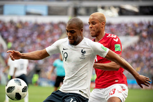 Djibril Sidibe of France and Mathias Jørgensen of Denmark