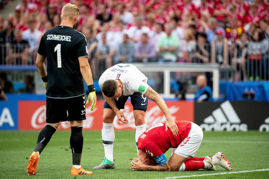Olivier Giroud of France and Simon Kjaer of Denmark