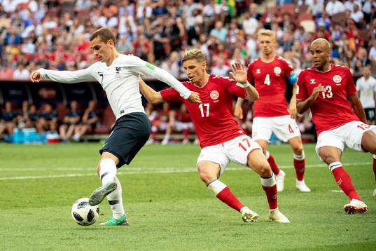 Antoine Griezmann of France and Jens Stryger Larsen of