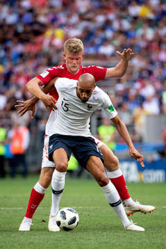 Andreas Cornelius of Denmark and Steven Nzonzi of France