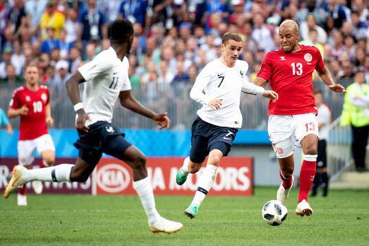 Antoine Griezmann of France and Mathias Jørgensen of