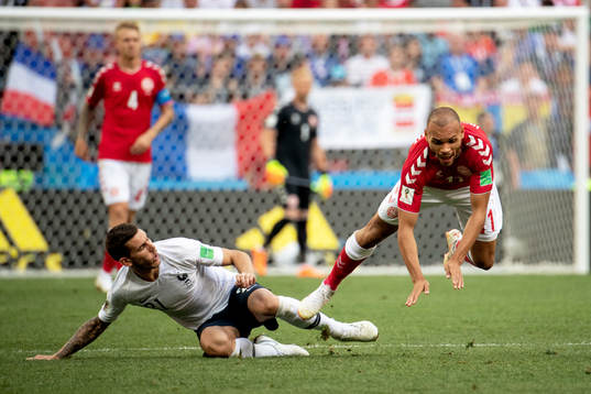Lucas Hernandez of France and Martin Braithwaite of Denmark