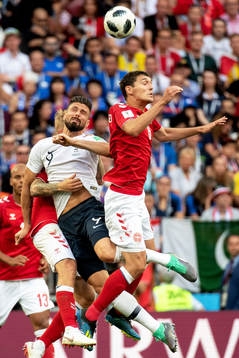 Thomas Delaney of Denmark and Olivier Giroud of France