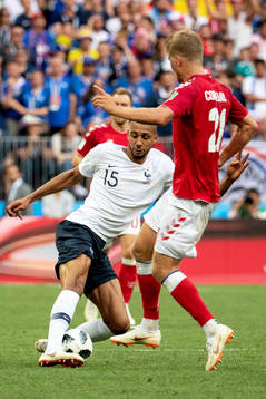 Steven Nzonzi of France and Andreas Cornelius of Denmark