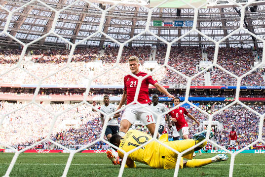 Andreas Cornelius of Denmark against goalkeeper Steve