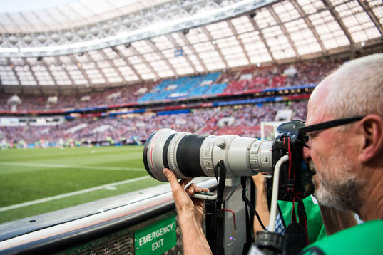 A photographer cover the FIFA World Cup group stage match
