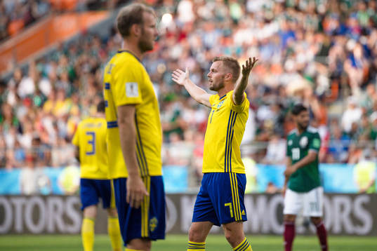Ola Toivonen and Sebastian Larsson of Sweden looks dejected