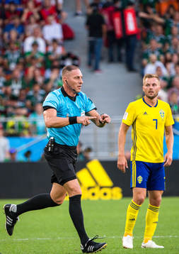 Referee Nestor Pitana with the sign for VAR