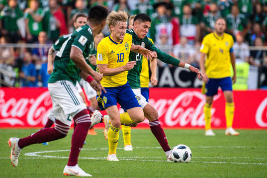 Emil Forsberg of Sweden and Edson Alvarez of Mexico