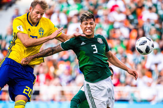 Ola Toivonen of Sweden and Carlos Salcedo of Mexico