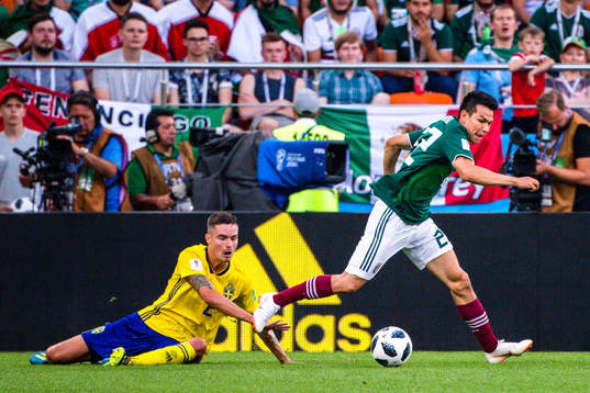 Mikael Lustig of Sweden and Rafael Marquez  of Mexico