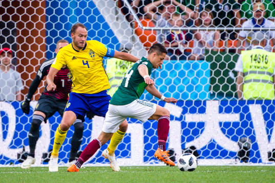 Andreas Granqvist of Sweden and Javier Hernandez  of Mexico